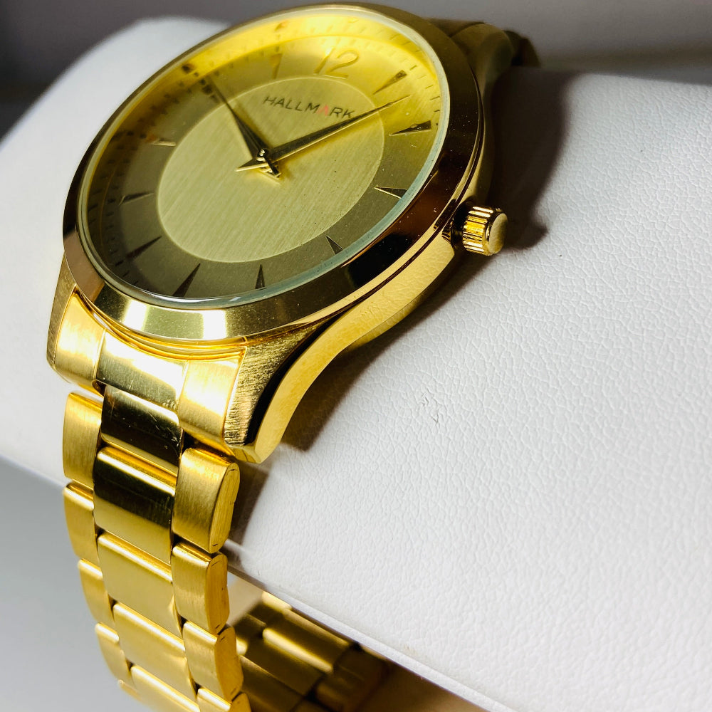 Gold watch with a detailed face on a light background. watches jewellery gold jewellery Deep Shine Jewellers