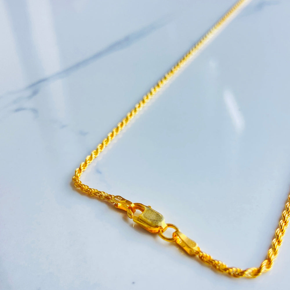 Gold chain on a marble surface gold rope chain men women ladies gents queens kings 925 silver sterling silver exclusive design affordable luxury trending pieces Deep Shine Jewellers jewellery jewelry gold plated golden Your Time To Shine DSJ quality premium beauty
