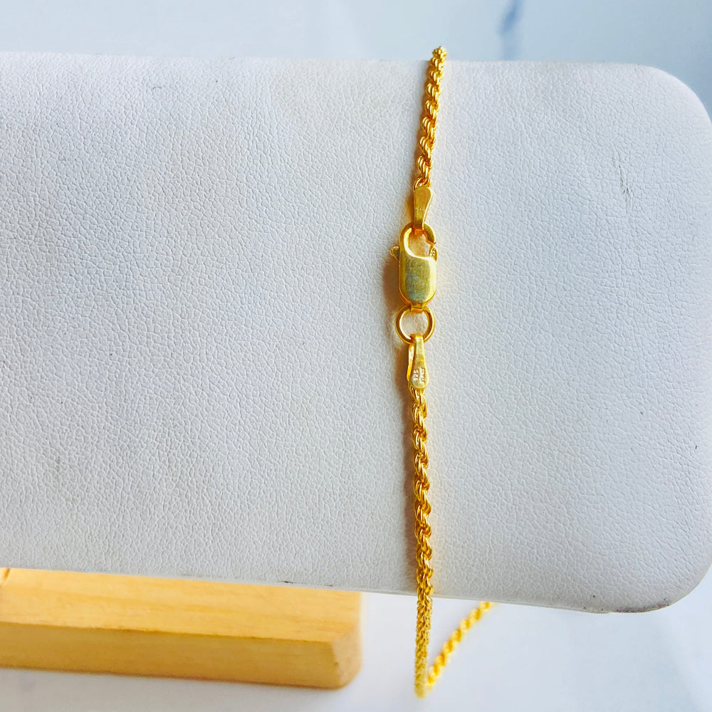 Gold bracelet on a white marble surface Gold chain on a marble surface gold rope chain men women ladies gents queens kings 925 silver sterling silver exclusive design affordable luxury trending pieces Deep Shine Jewellers jewellery jewelry gold plated golden Your Time To Shine DSJ quality premium beauty
