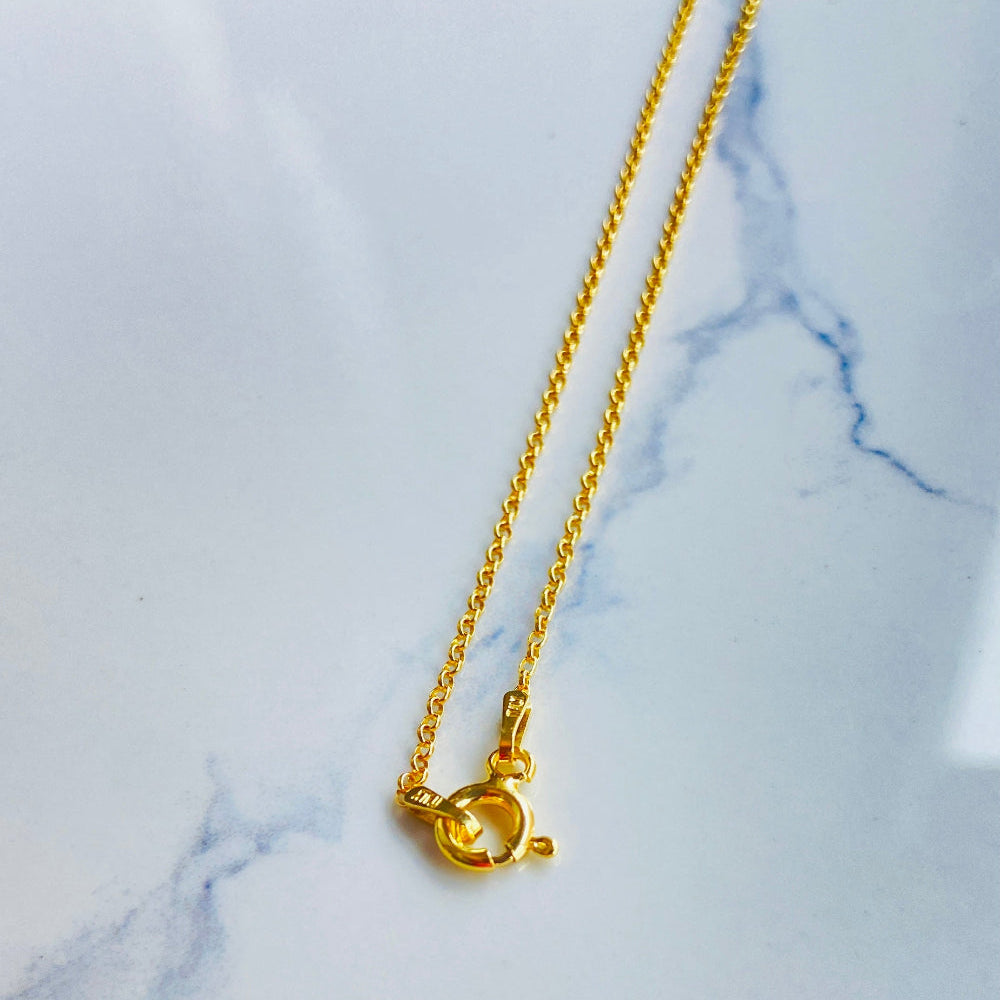 Gold necklace on a marble background Gold chain necklace on a light gray textured background gold belcher chain women ladies queens gold plated golden 925 silver sterling silver affordable luxury premium jewelllery jewelry high quality trending shop now best selling Deep Shine Jewellers Your Time To Shine DSJ store 