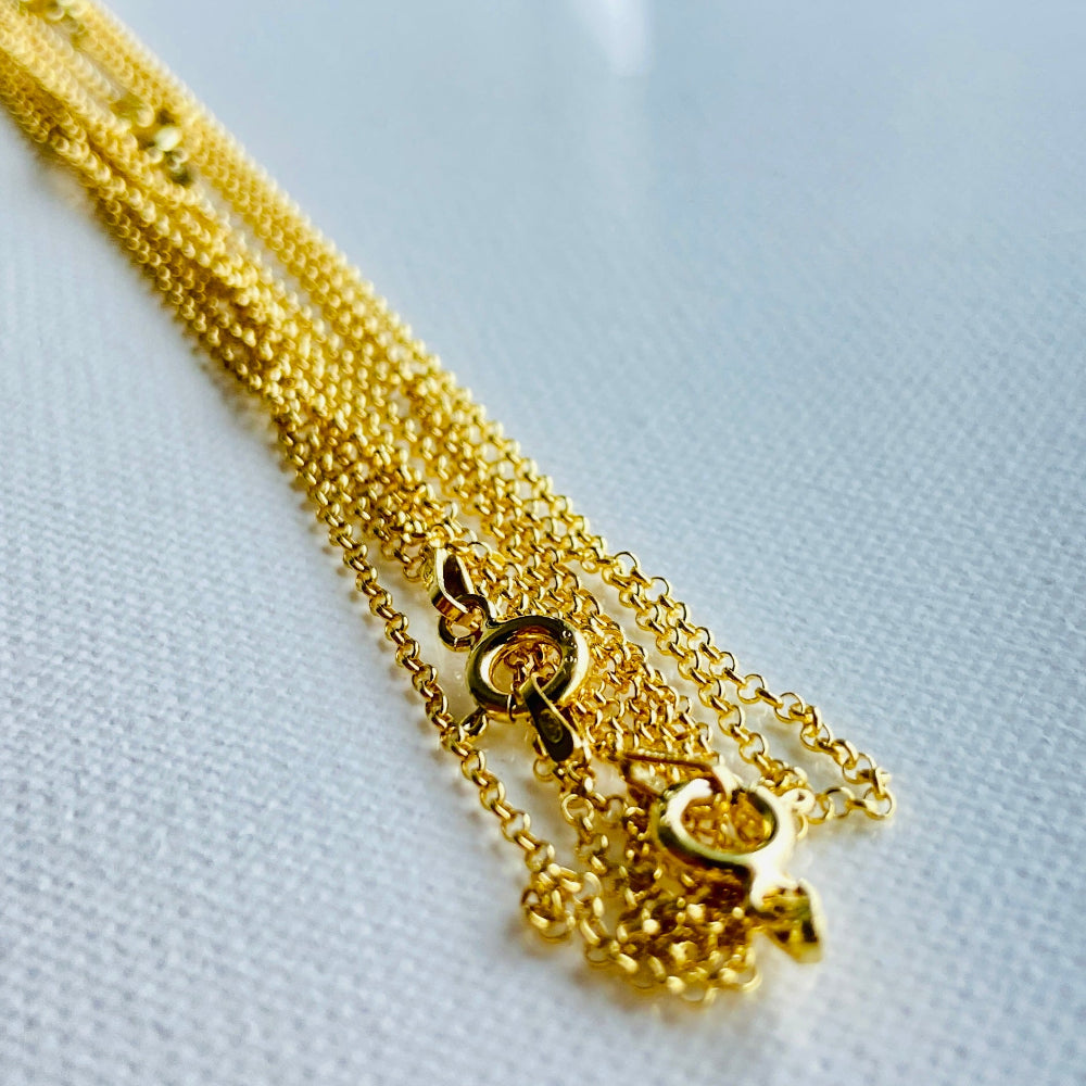 Gold bracelet with intricate design on a light gray background Gold chain necklace on a light gray textured background gold belcher chain women ladies queens gold plated golden 925 silver sterling silver affordable luxury premium jewelllery jewelry high quality trending shop now best selling Deep Shine Jewellers Your Time To Shine DSJ store 