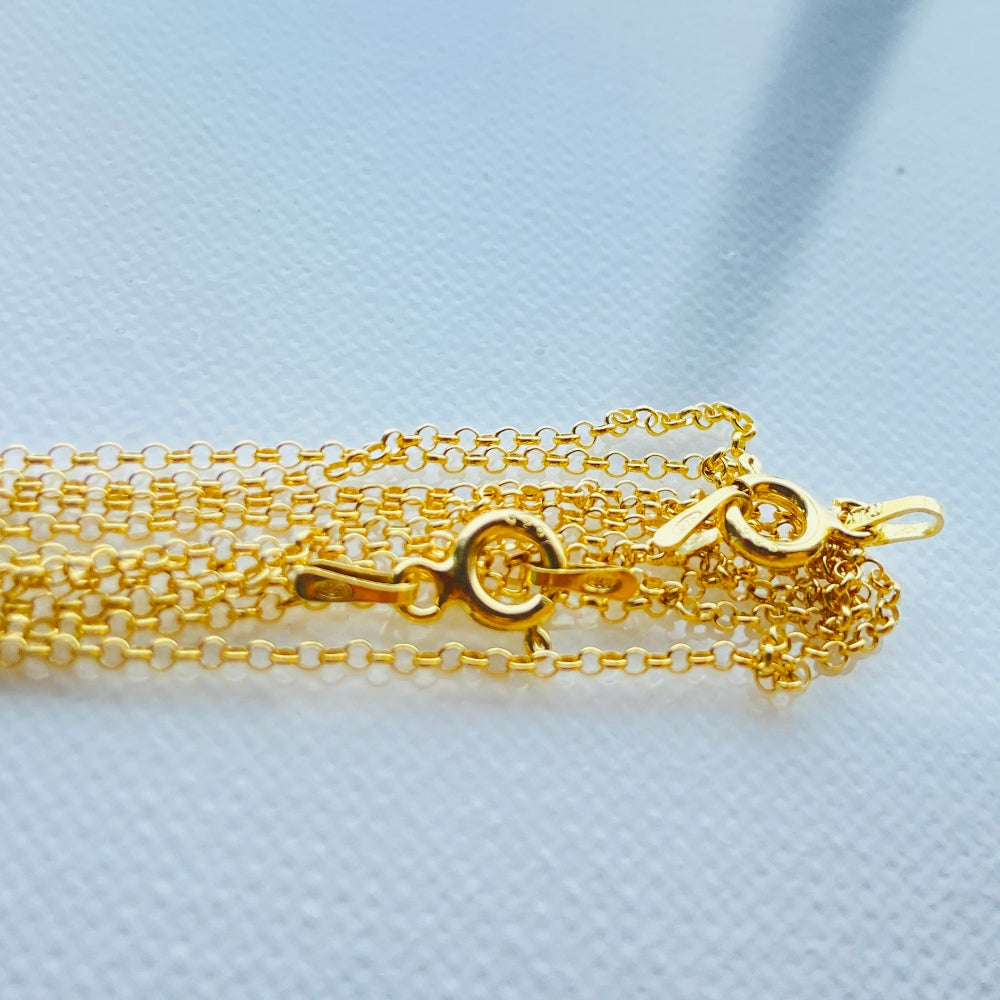 Gold chain necklace on a light blue textured background Gold chain necklace on a light gray textured background gold belcher chain women ladies queens gold plated golden 925 silver sterling silver affordable luxury premium jewelllery jewelry high quality trending shop now best selling Deep Shine Jewellers Your Time To Shine DSJ store 