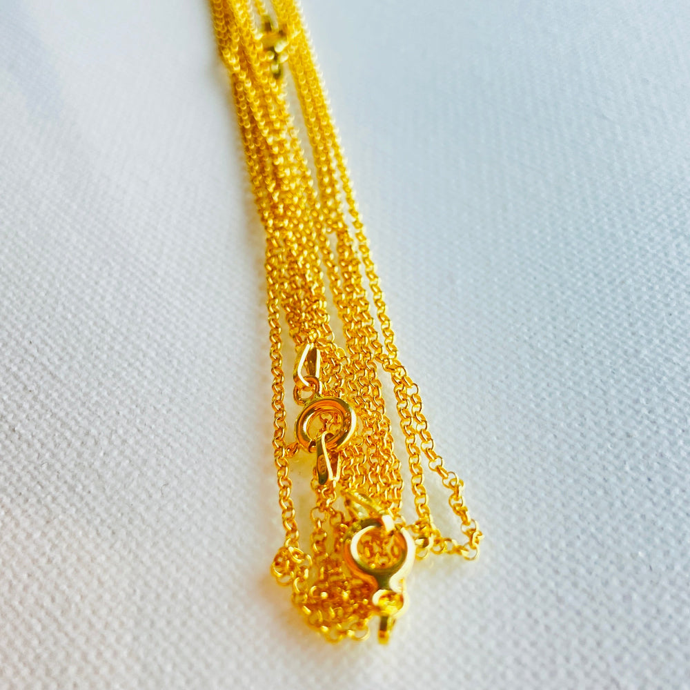 Gold necklace with a heart pendant on a light gray background Gold chain necklace on a light gray textured background gold belcher chain women ladies queens gold plated golden 925 silver sterling silver affordable luxury premium jewelllery jewelry high quality trending shop now best selling Deep Shine Jewellers Your Time To Shine DSJ store 