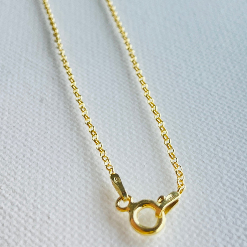 Gold necklace on a white background Gold chain necklace on a light gray textured background gold belcher chain women ladies queens gold plated golden 925 silver sterling silver affordable luxury premium jewelllery jewelry high quality trending shop now best selling Deep Shine Jewellers Your Time To Shine DSJ store 