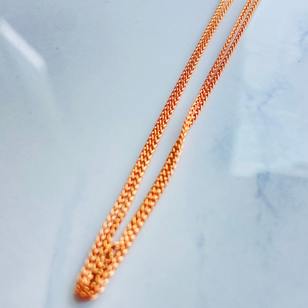 Rose gold necklace on a light blue marble surface rose gold wheat chain necklace women ladies queens 925 silver sterling silver rose gold plating roses premium jewellery jewelry affordable luxury elegant best seller trending Deep Shine Jewellers DSJ Your Time To Shine