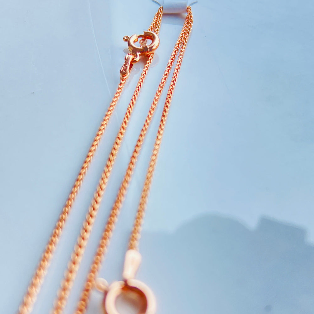 Rose gold necklace on a light blue background Rose gold necklace on a light blue marble surface rose gold wheat chain necklace women ladies queens 925 silver sterling silver rose gold plating roses premium jewellery jewelry affordable luxury elegant best seller trending Deep Shine Jewellers DSJ Your Time To Shine