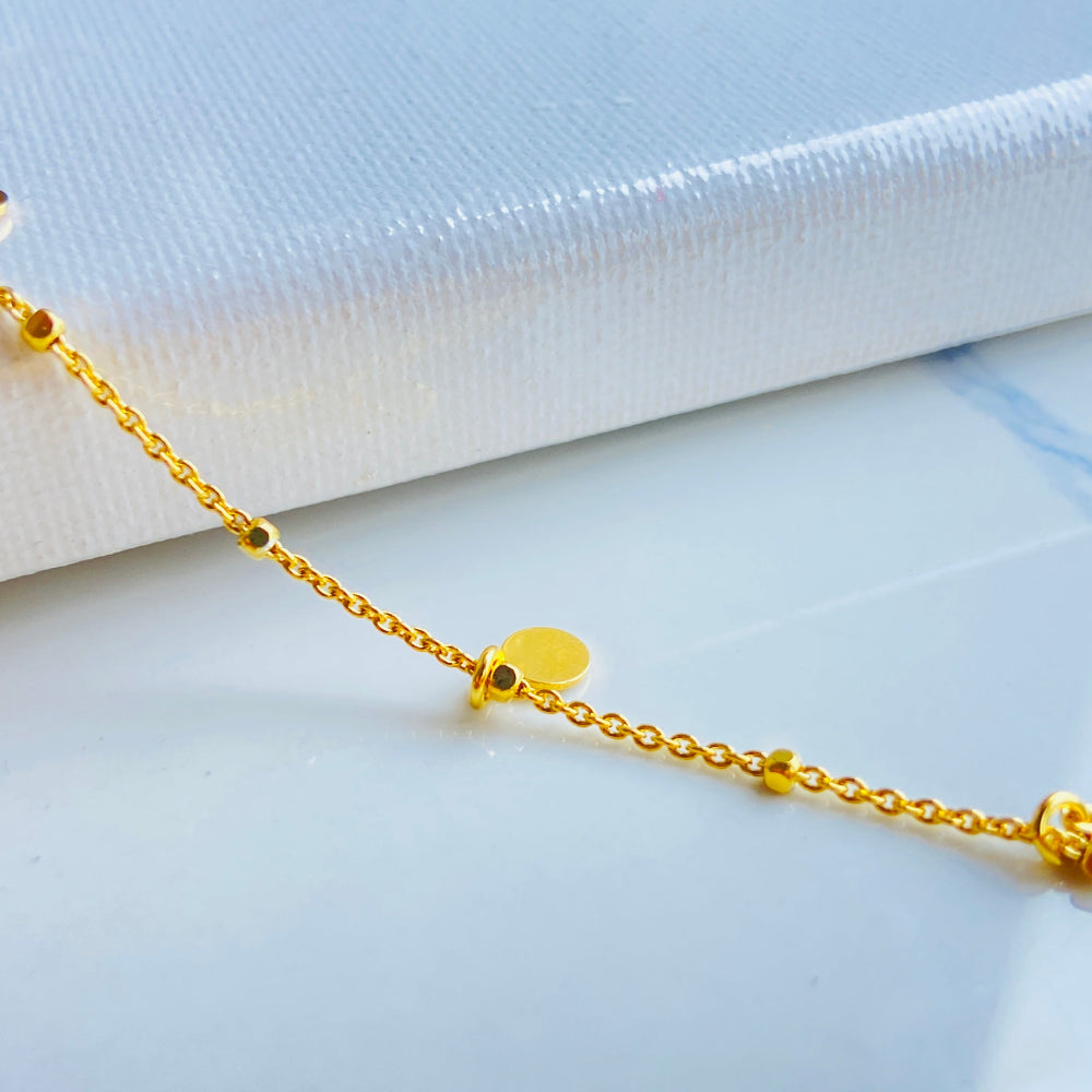 Gold chain bracelet on a light blue fabric background Shine Bright with Deep Shine Jewellers Exclusive Gold Circle and Chain Bracelet women ladies queens 925 silver sterling silver gold plated golden premium jewellery jewelry affordable luxury best sellers trending christmas gifts loved ones Your Time To Shine DSJ exclusive craftsmanship 