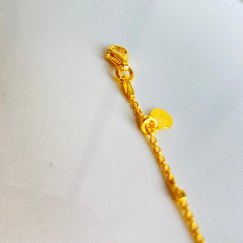 Gold bracelet on a white surface Gold chain bracelet on a light blue fabric background Shine Bright with Deep Shine Jewellers Exclusive Gold Circle and Chain Bracelet women ladies queens 925 silver sterling silver gold plated golden premium jewellery jewelry affordable luxury best sellers trending christmas gifts loved ones Your Time To Shine DSJ exclusive craftsmanship 