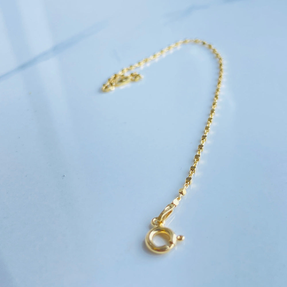 Gold necklace on a light blue fabric background Gold chain on a light blue marble surface gold block bead bracelet women ladies queens gold plated golden 925 silver sterling silver buy now exclusive craftsmanship affordable luxury best sellers trending beauty premium quality jewellery jewelry Deep Shine Jewellers Your Time To Shine DSJ shop now 