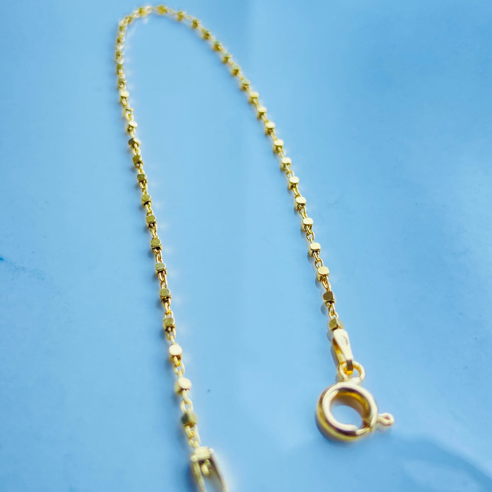 Gold necklace with clasp on a blue fabric background Gold chain on a light blue marble surface gold block bead bracelet women ladies queens gold plated golden 925 silver sterling silver buy now exclusive craftsmanship affordable luxury best sellers trending beauty premium quality jewellery jewelry Deep Shine Jewellers Your Time To Shine DSJ shop now 