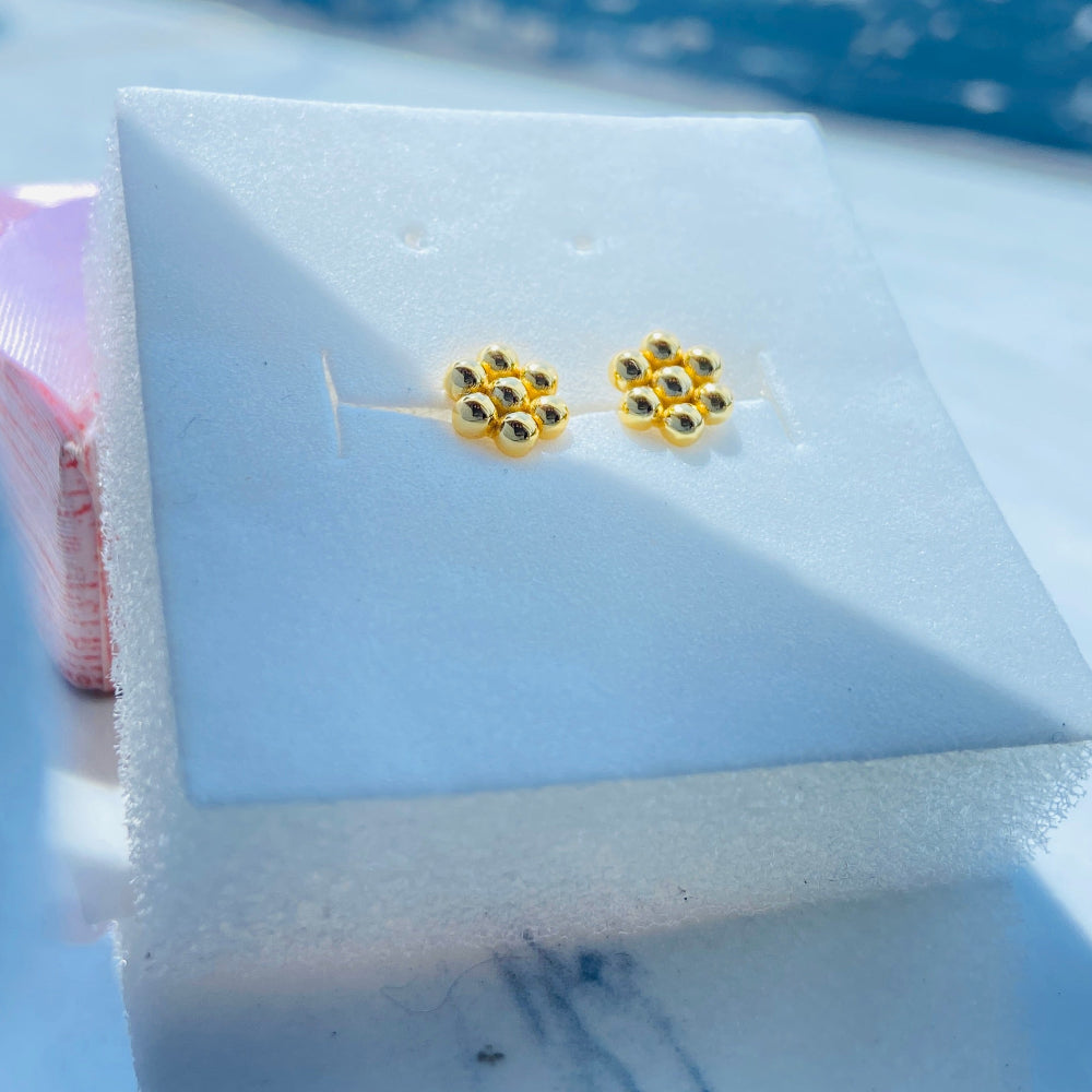 Gold paw print earrings on a white card with a blue background Gold earrings with gemstones on a white stand against a blue background gold round bee hive earring for men women ladies gents kings queens 925 silver sterling silver gold plated golden exclusive craftsmanship Deep Shine Jewellers jewellery jewelry Your Time To Shine DSJ Trending Shop now