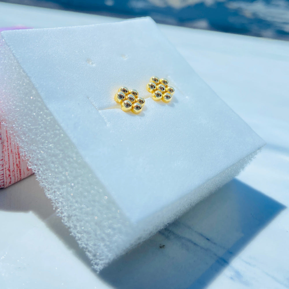 Gold earrings with gemstones on a white stand against a blue background gold round bee hive earring for men women ladies gents kings queens 925 silver sterling silver gold plated golden exclusive craftsmanship Deep Shine Jewellers jewellery jewelry Your Time To Shine DSJ Trending Shop now