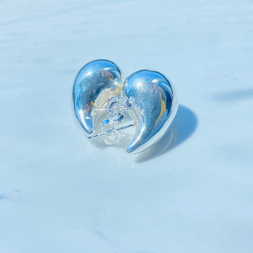 Heart-shaped object on a white surface with blue background silver drop form earrings for women ladies queens silver 925 silver sterling silver exclusive jewellery jewelry by Deep Shine Jewellers Your Time To Shine DSJ shinning beauty