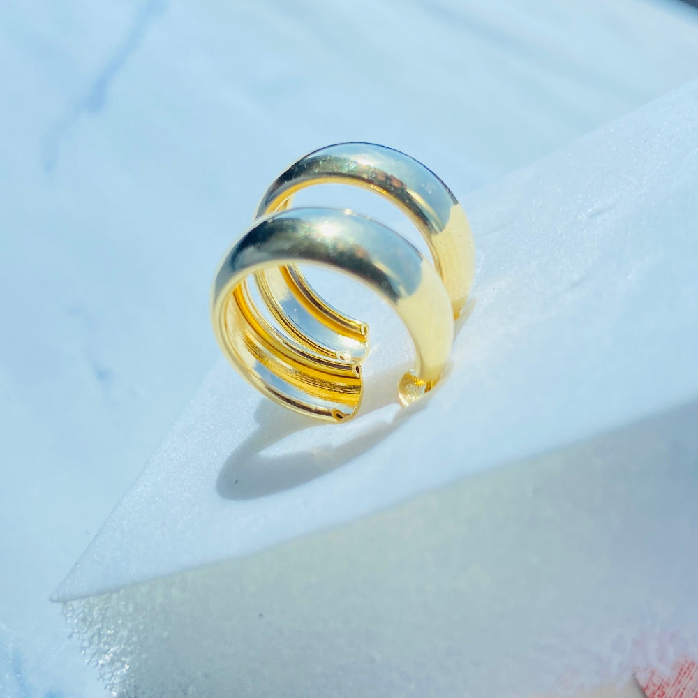 Gold ring on a white surface with a blue background Gold ring on a white surface with a blue background thick gold sleeper hoop earrings women ladies queens exclusive affordable luxury Deep Shine Jewellers jewellery jewelry gold plated 925 silver sterling silver Your Time To Shine DSJ craftsmanship trending shop now