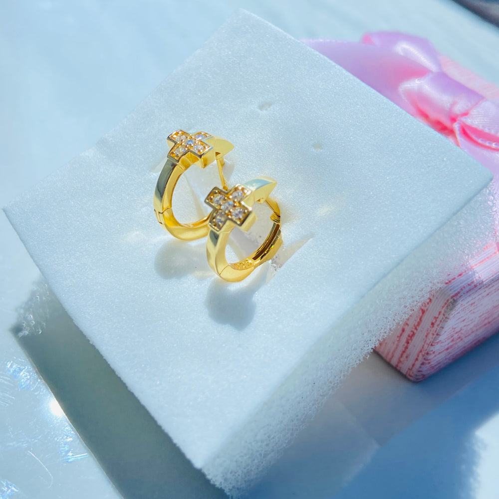 Gold ring with diamonds on a white cushion in a jewelry box Gold ring with gemstones on a light blue background gold plus ice sleeper hoop earrings for women ladies queens 925 silver sterling silver cubic zirconia diamonds lab diamonds exclusive Deep Shine Jewellers jewellery jewelry trending Your Time To Shine DSJ