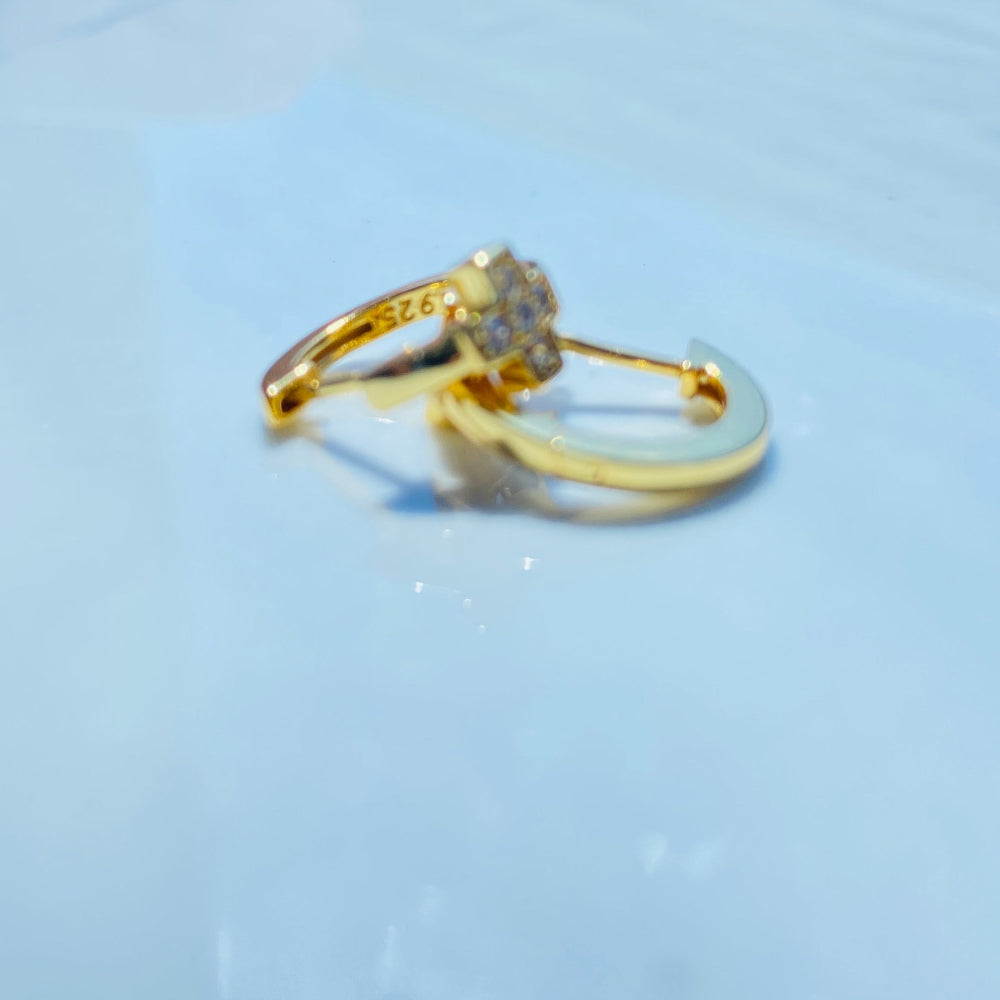 Gold ring with gemstones on a light blue background gold plus ice sleeper hoop earrings for women ladies queens 925 silver sterling silver cubic zirconia diamonds lab diamonds exclusive Deep Shine Jewellers jewellery jewelry trending Your Time To Shine DSJ