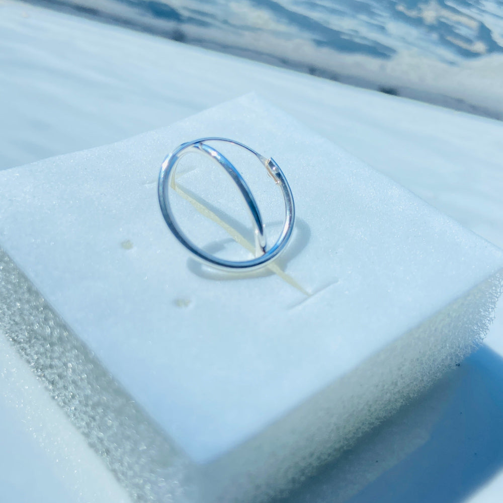 Silver ring on a white stand with a blue background Two silver rings on a light blue fabric surface silver sleeper hoop earrings for king queen womens mens 925 silver sterling silver exclusive Deep Shine Jewellers jewellery jewelry Your Time To Shine shop now DSJ affordable luxury high quality