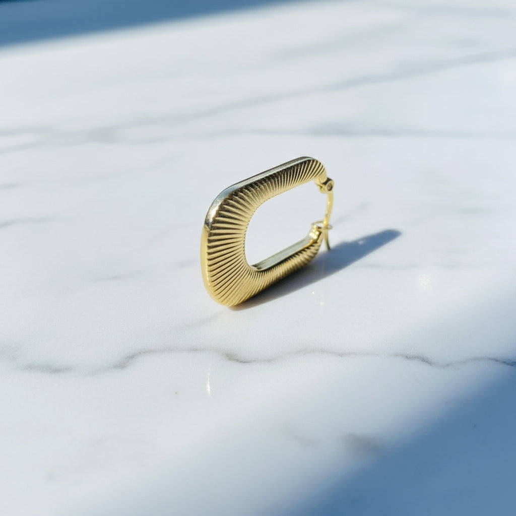 Gold hoop earring on a white stand with a blue background Gold striped rectangle earrings jewellery jewelry Deep Shine Jewellers stainless steel gold-plated affordable luxury DSJ Your Time To Shine exclusive radiant womens lady's queens kingdom