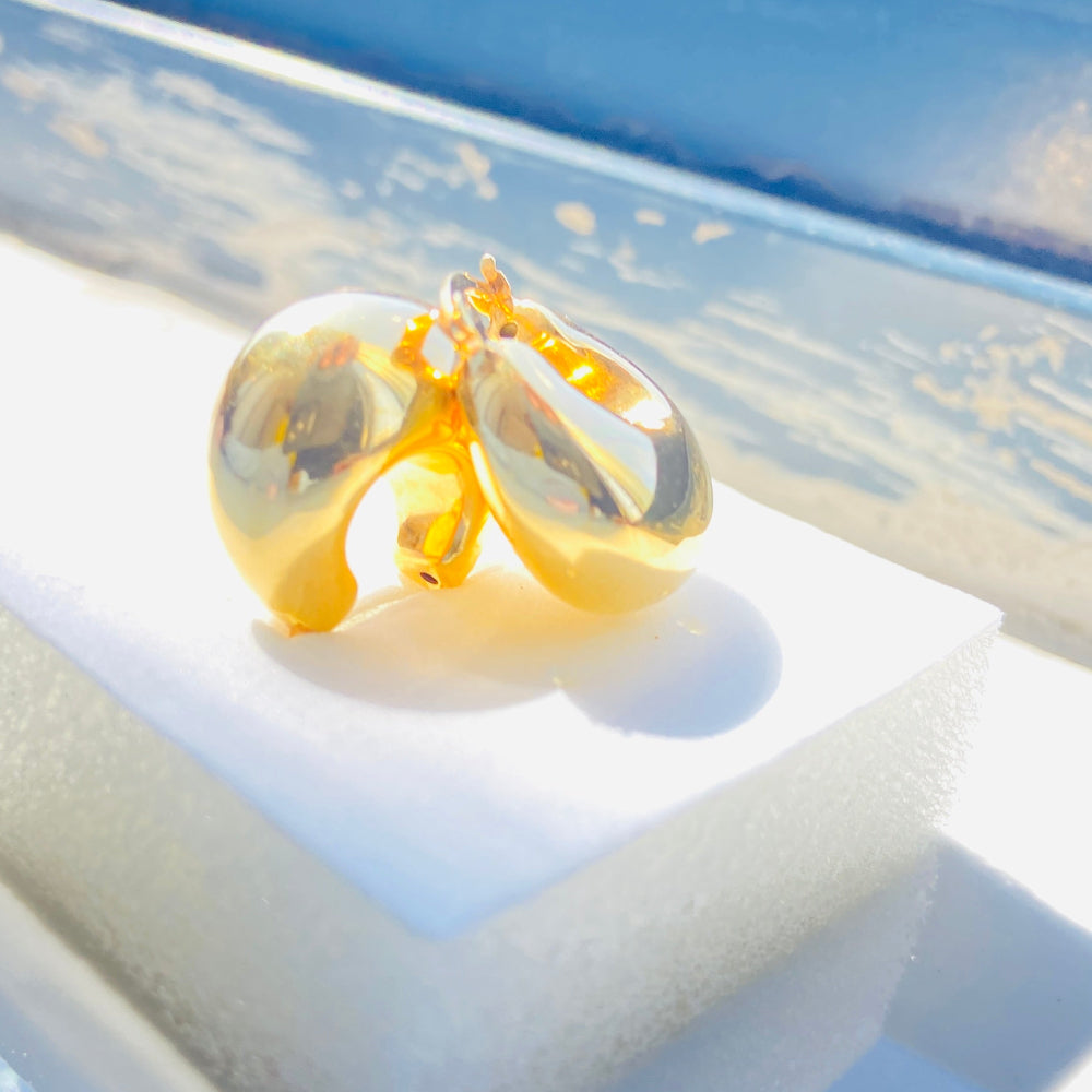 Gold hoop earrings on a white stand with a light blue background gold silver bubble dome hoop earrings for women ladies queens exclusive craftsmanship gold 925 silver sterling silver gold-plated jewellery jewelry Deep Shine Jewellers DSJ Your Time To Shine affordable luxury beauty trendy shop now 