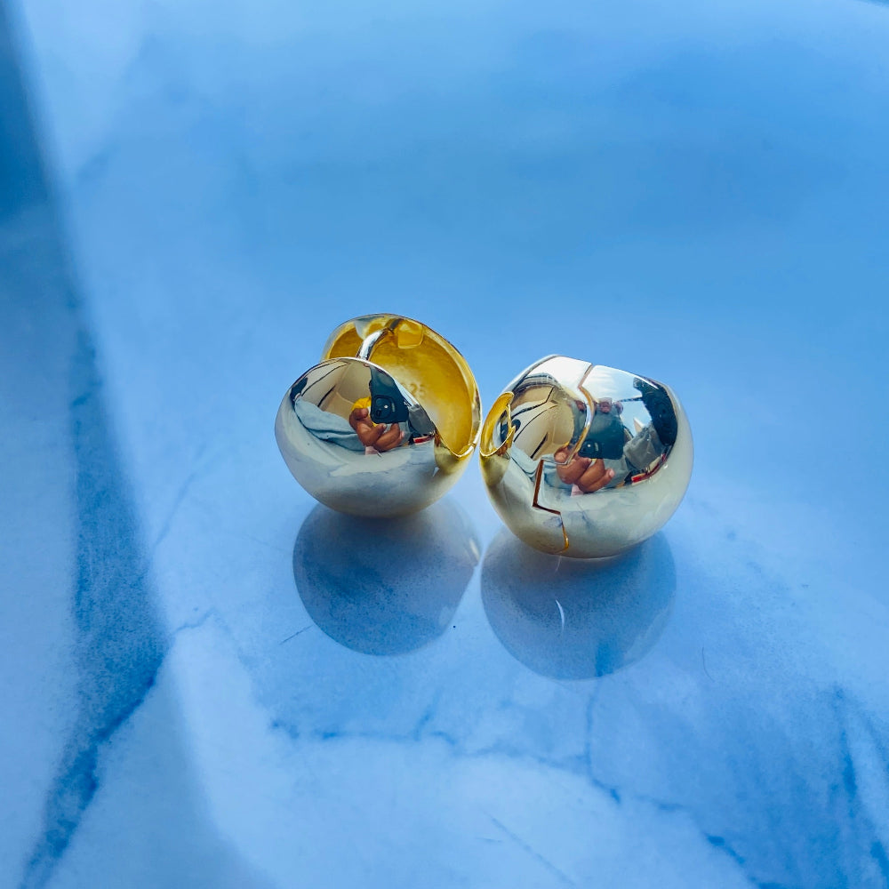 Gold and silver round earrings on a light blue background gold dome silver earrings for queens ladies women 925 silver sterling silver exclusive craftsmanship Deep Shine Jewellers DSJ Your Time To Shine golden affordable luxury jewellery jewelry 