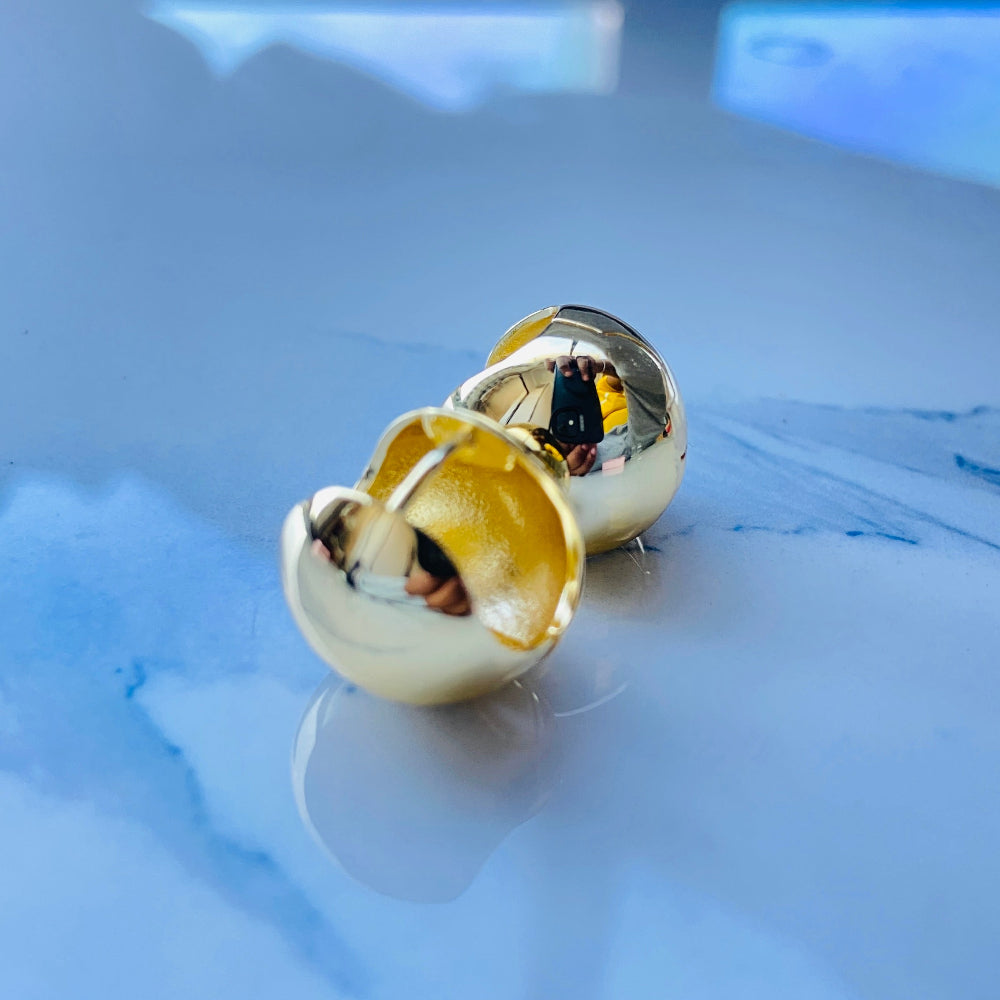 Gold earrings on a reflective surface gold dome silver earrings for queens ladies women 925 silver sterling silver exclusive craftsmanship Deep Shine Jewellers DSJ Your Time To Shine golden affordable luxury jewellery jewelry 