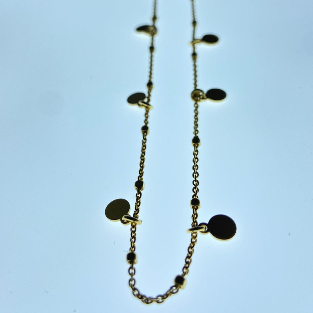 Gold chain necklace on a light blue background Gold necklace with round pendants on a blue marble surface Radiant Gold Circle and Block Link Necklace by Deep Shine Jewellers gold plated golden 925 silver sterling silver women ladies queens elegant exclusive craftsmanship cape town artisans affordable luxury premium jewellery jewelry chains best sellers trending online store shop now Your Time To Shine DSJ 