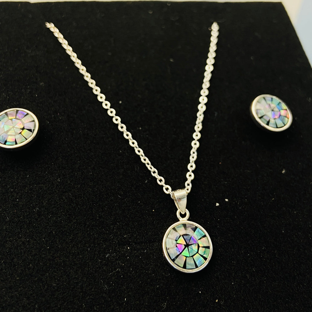 Silver necklace and earrings set on a black background Two necklaces with round pendants on a marble surface silver paua necklace and earrings set chain women ladies queens 925 silver sterling silver exclusive craftsmanship elegance affordable luxury premium jewellery jewelry cape town artisans high quality best sellers trending Deep Shine Jewellers DSJ Your Time To Shine shop now kingdom Christmas sale 