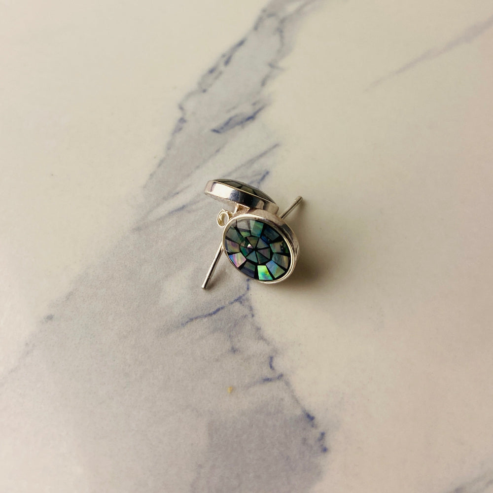 Silver ring with green gemstone on a marble surface Two necklaces with round pendants on a marble surface silver paua necklace and earrings set chain women ladies queens 925 silver sterling silver exclusive craftsmanship elegance affordable luxury premium jewellery jewelry cape town artisans high quality best sellers trending Deep Shine Jewellers DSJ Your Time To Shine shop now kingdom Christmas sale 