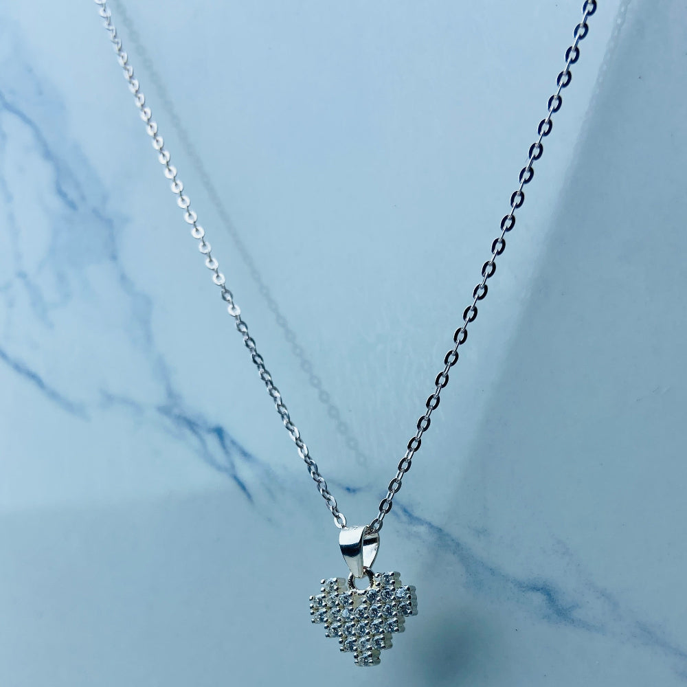  Silver butterfly-shaped earrings on a marble surface Radiant Silver Pixelated Heart Necklace and Earrings Set by Deep Shine Jewellery women ladies queens 925 silver sterling silver cubic zirconia gemstone diamond lab diamond exclusive craftsmanship cape town artisans affordable luxury best seller trending christmas sale gift wishlish Your Time To Shine DSJ online store shop now 