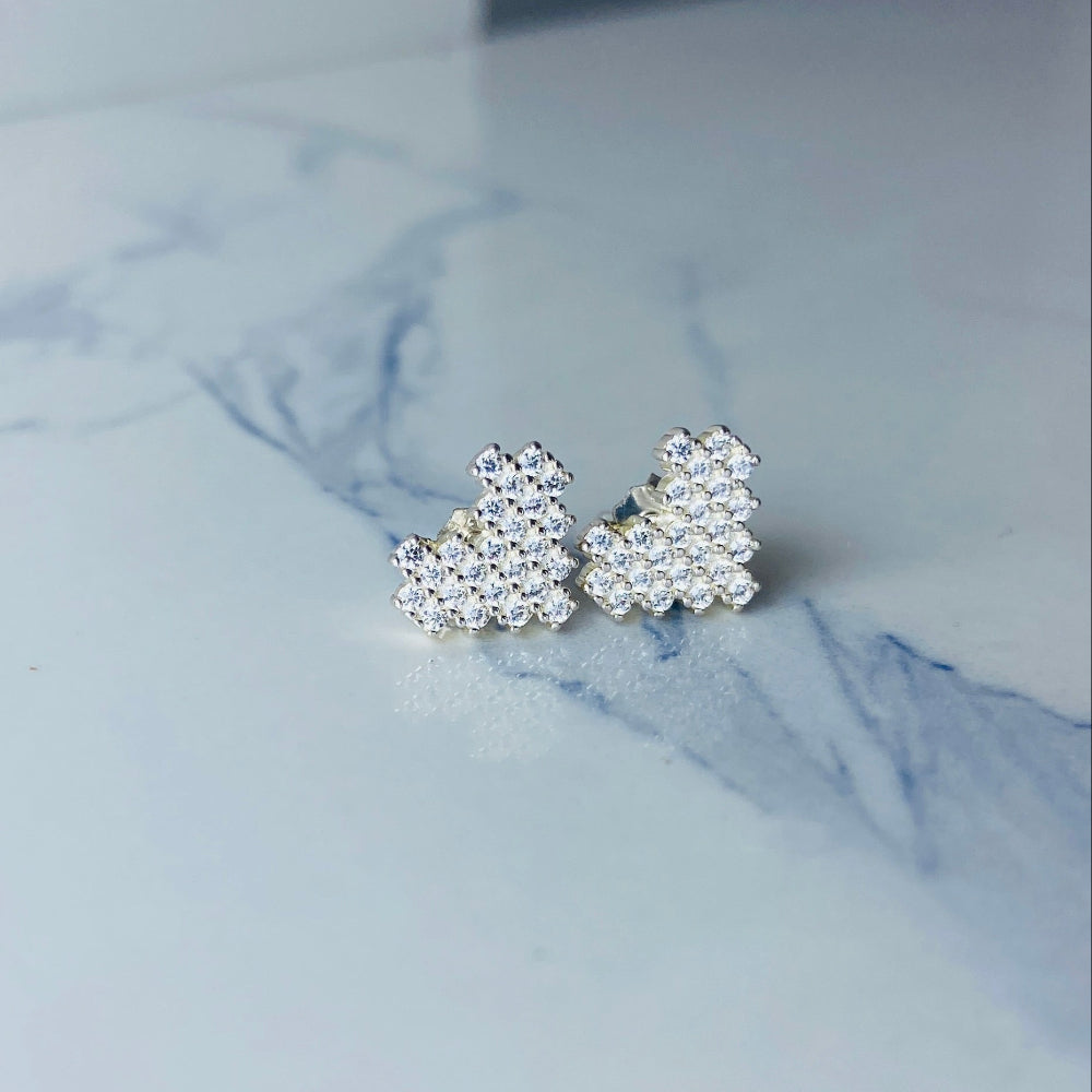 Pearl stud earrings on a marble surface Silver butterfly-shaped earrings on a marble surface Radiant Silver Pixelated Heart Necklace and Earrings Set by Deep Shine Jewellery women ladies queens 925 silver sterling silver cubic zirconia gemstone diamond lab diamond exclusive craftsmanship cape town artisans affordable luxury best seller trending christmas sale gift wishlish Your Time To Shine DSJ online store shop now 