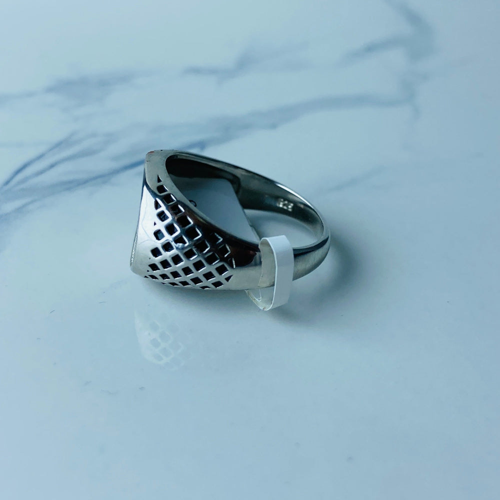 Silver ring with a textured design on a light blue marble surface Silver ring with textured design on a light gray surface silver ice ring mens gents kings diamonds lab diamonds gemstones 925 silver sterling silver black enamel cubic zirconias band ring exclusive craftsmanship affordable luxury premium materials high quality jewellery jewelry Deep Shine Jewellers DSJ Your Time To Shine best sellers unique pieces trending christmas sale gifts presents 