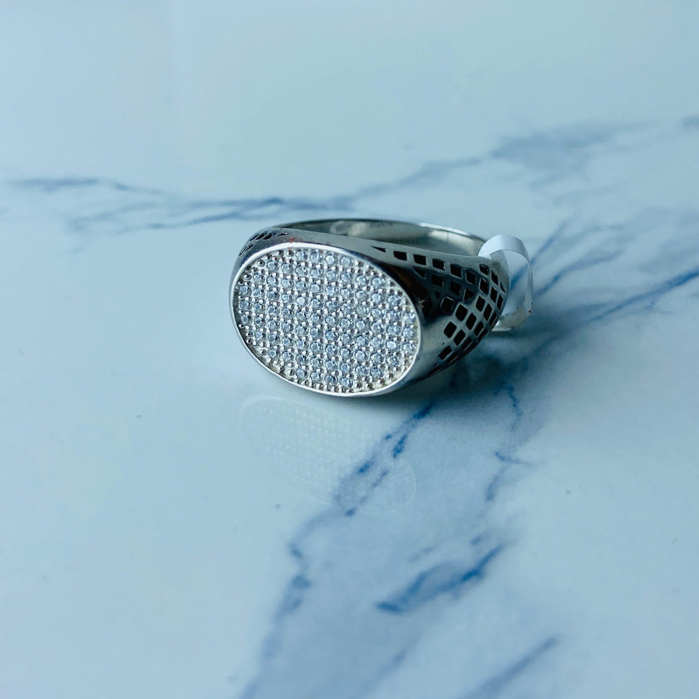 Silver ring with gemstones on a marble surface Silver ring with textured design on a light gray surface silver ice ring mens gents kings diamonds lab diamonds gemstones 925 silver sterling silver black enamel cubic zirconias band ring exclusive craftsmanship affordable luxury premium materials high quality jewellery jewelry Deep Shine Jewellers DSJ Your Time To Shine best sellers unique pieces trending christmas sale gifts presents 