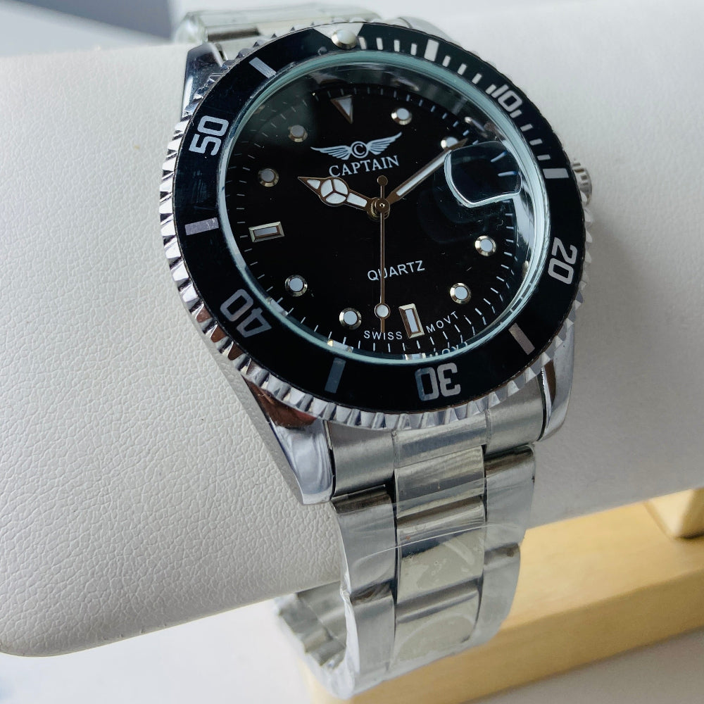 Silver wristwatch with black dial on a white surface Silver watch with black dial on a white surface captain mens watch black dial stainless steel rotating bezel quartz movement swiss movement timepiece watches timeless elegance brand new polished watched sapphire crystal hour markings jewellery jewelry premium quality affordable luxury best sellers trending shop now Deep Shine Jewellers DSJ Your Time To Shine mens gents kings 