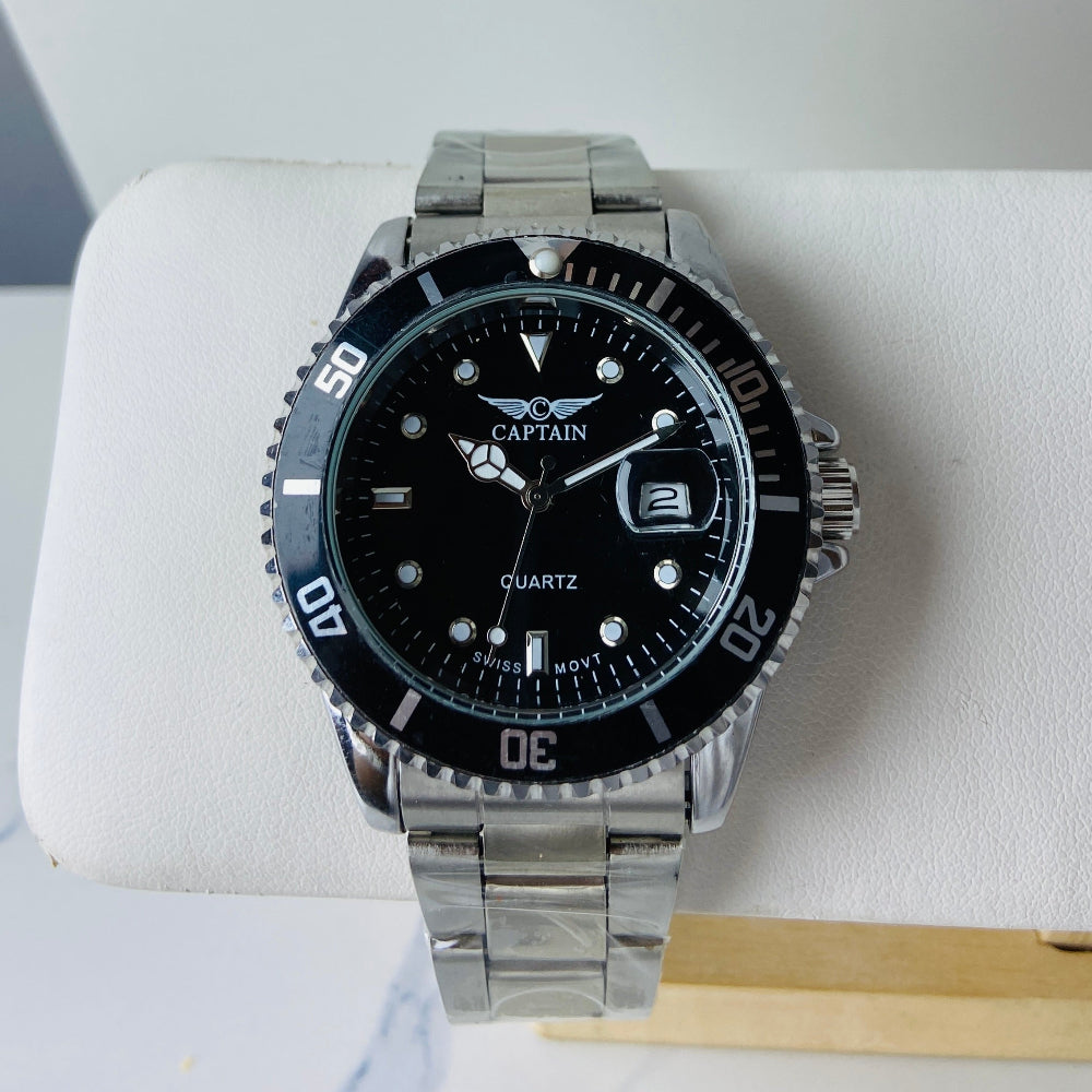 Watch with black face and silver case on a white cushion Silver watch with black dial on a white surface captain mens watch black dial stainless steel rotating bezel quartz movement swiss movement timepiece watches timeless elegance brand new polished watched sapphire crystal hour markings jewellery jewelry premium quality affordable luxury best sellers trending shop now Deep Shine Jewellers DSJ Your Time To Shine mens gents kings 