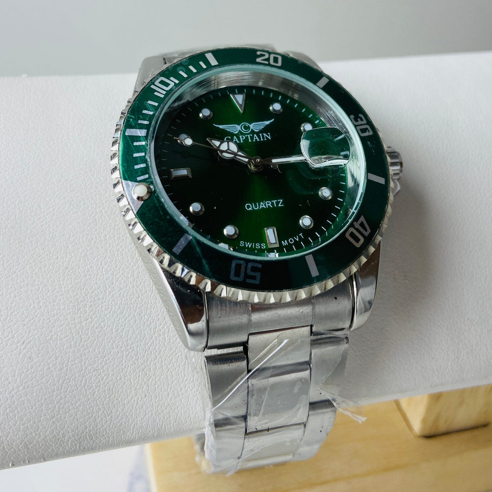 Wristwatch with green dial and silver metal strap on a white surface Silver watch with black dial on a white surface captain mens watch black dial stainless steel rotating bezel quartz movement swiss movement timepiece watches timeless elegance brand new polished watched sapphire crystal hour markings jewellery jewelry premium quality affordable luxury best sellers trending shop now Deep Shine Jewellers DSJ Your Time To Shine mens gents kings 