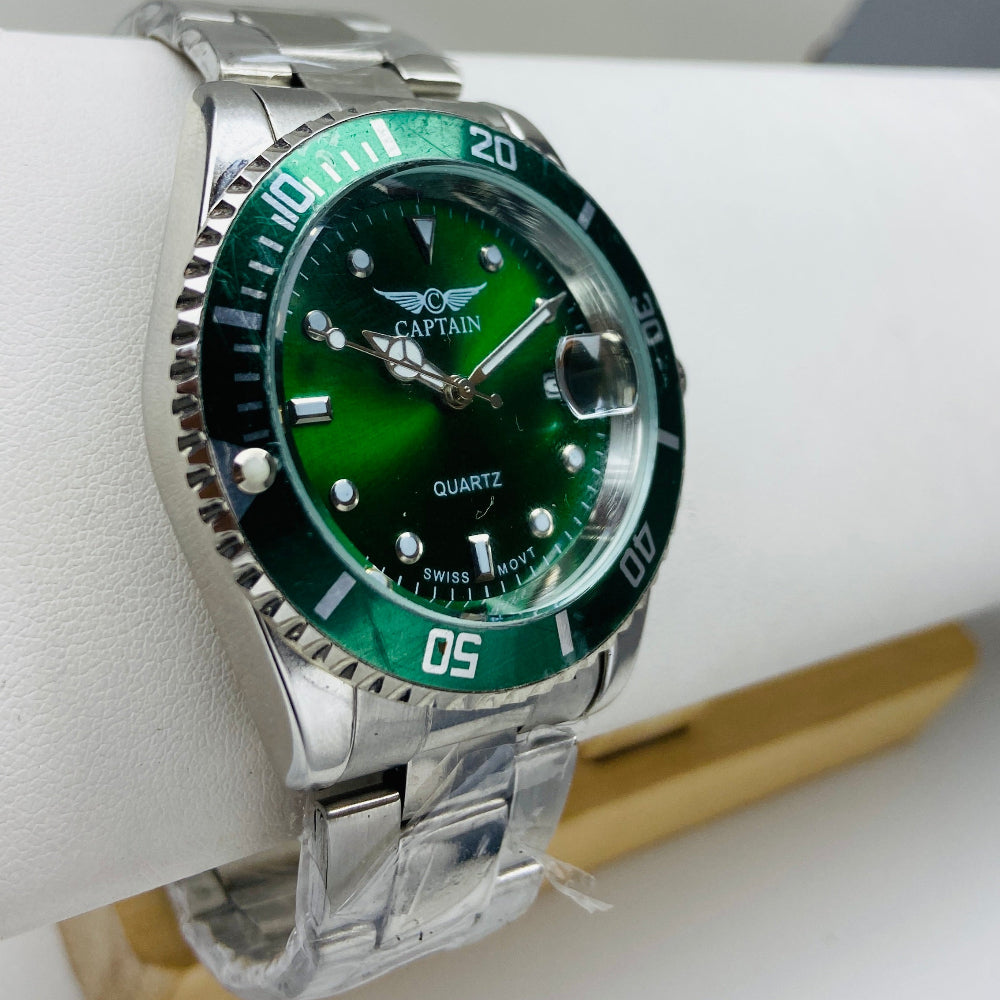Green wristwatch with silver band on a white surface Silver watch with black dial on a white surface captain mens watch black dial stainless steel rotating bezel quartz movement swiss movement timepiece watches timeless elegance brand new polished watched sapphire crystal hour markings jewellery jewelry premium quality affordable luxury best sellers trending shop now Deep Shine Jewellers DSJ Your Time To Shine mens gents kings 