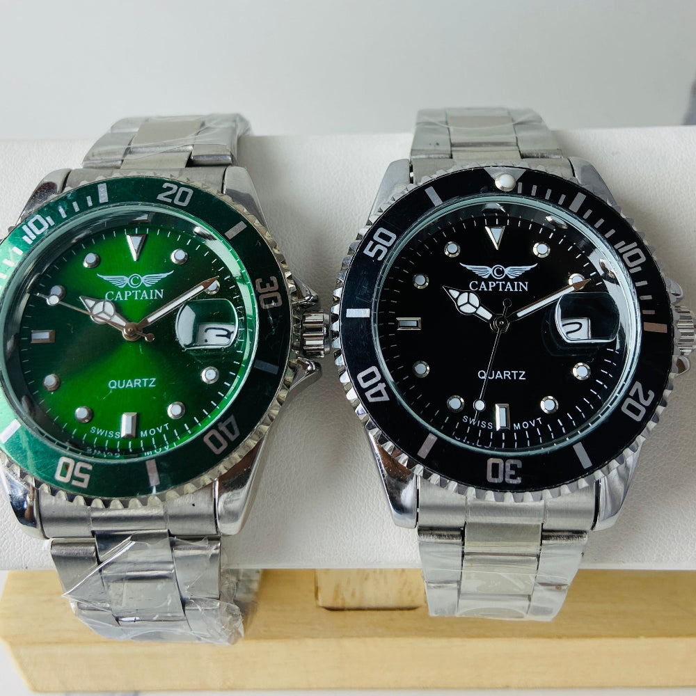 Two watches with green and black faces on a white background Silver watch with black dial on a white surface captain mens watch black dial stainless steel rotating bezel quartz movement swiss movement timepiece watches timeless elegance brand new polished watched sapphire crystal hour markings jewellery jewelry premium quality affordable luxury best sellers trending shop now Deep Shine Jewellers DSJ Your Time To Shine mens gents kings 