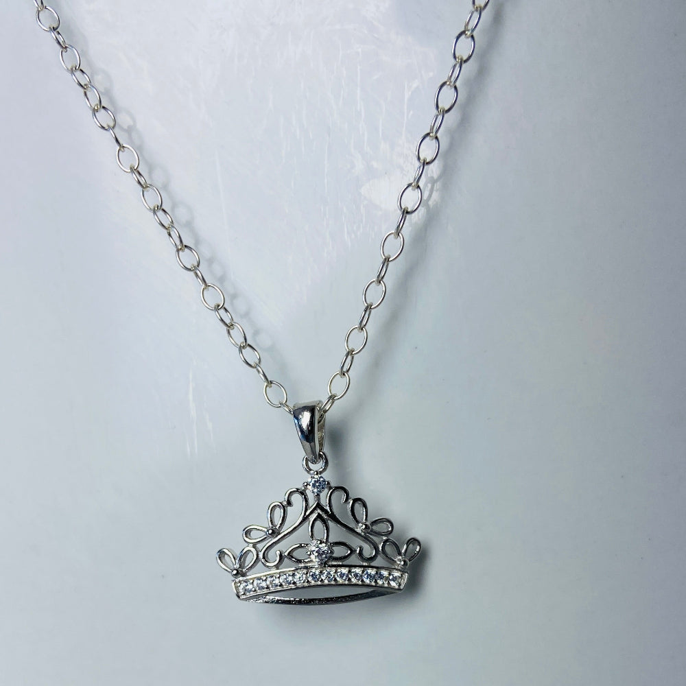 Silver necklace with a detailed pendant on a marble background Silver necklace silver crown pendant necklace chain exclusive craftsmanship affordable luxury premium jewellery jewelry ladies women queens Deep Shine Jewellers DSJ Your Time To Shine best seller trending 925 silver sterling silver diamond lab diamond gemstones cubic zirconia Christmas special sale festive season holidays gift loved ones cable chain