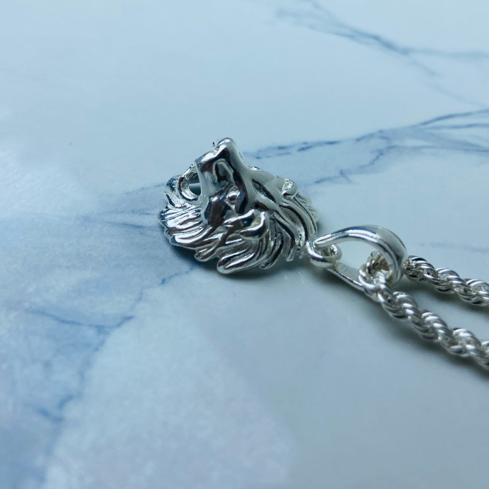 Silver chain with a clasp on a marble surface Silver lion head pendant on a chain against a marble background Silver Lions head pendant necklace marble surface pendant necklace curb chain exclusive craftsmanship affordable luxury premium jewellery jewelry ladies women queens kings mens gents Deep Shine Jewellers DSJ Your Time To Shine best seller trending 925 silver sterling silver cape town artisans christmas gifts present festive season holiday gifts for love ones