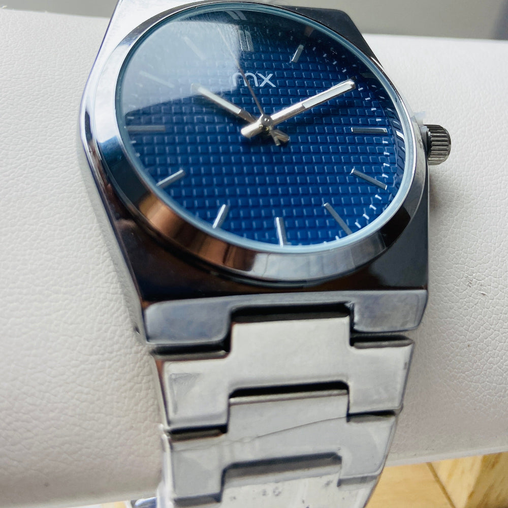 Silver watch with blue face on a white cushion Silver watch with a blue face on a white background silver watch with navy face on a white marble surface silver MX mens watch stainless steel watches timepiece timeless luxury best seller trending Deep Shine Jewellers DSJ Your Time To Shine quartz movement black dial silver stick markers 36mm silver bezel christmas presents gifts holiday season festive season xmas christmas sale Cape town south africa 