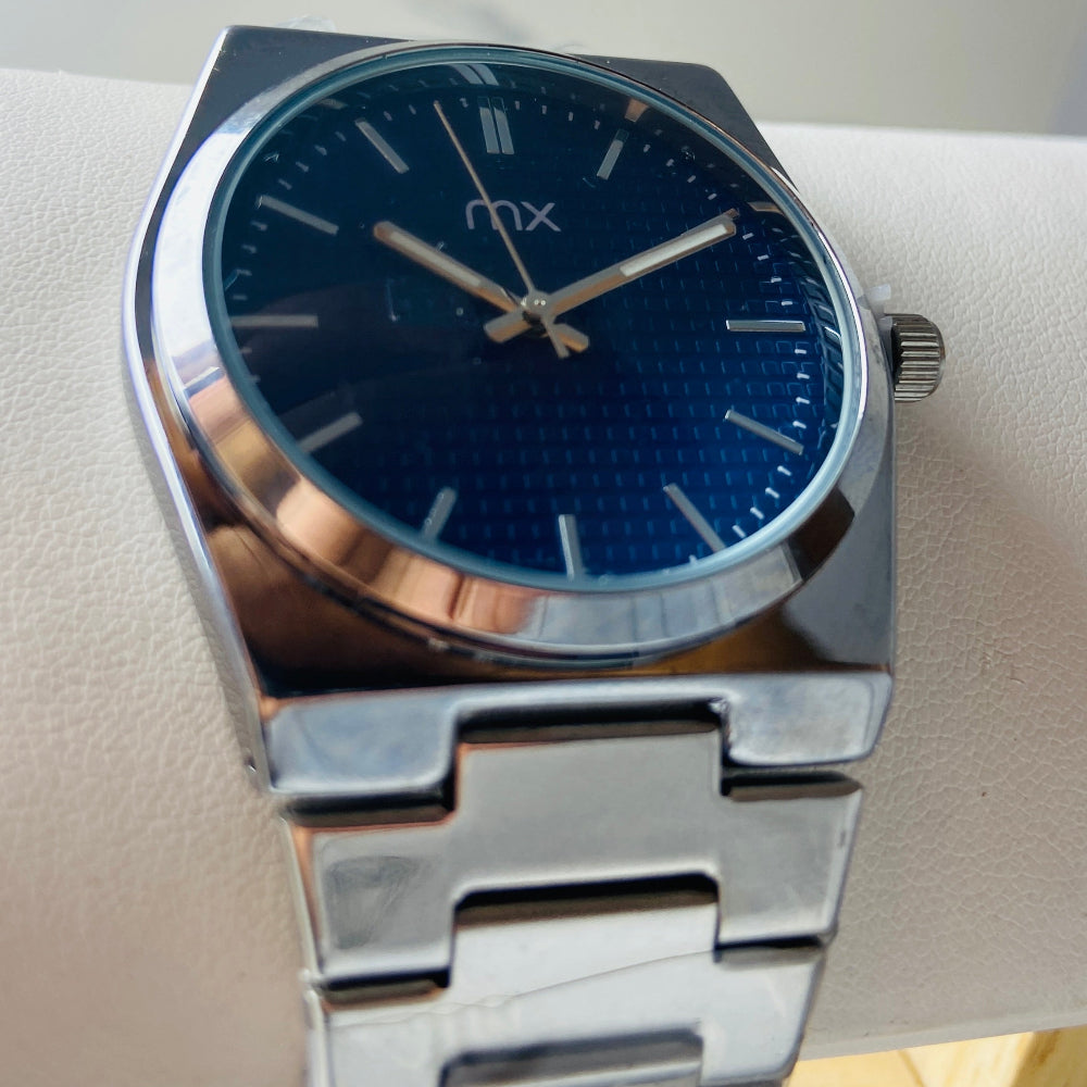 Silver watch with a blue face on a white surface Silver watch with a blue face on a white background silver watch with navy face on a white marble surface silver MX mens watch stainless steel watches timepiece timeless luxury best seller trending Deep Shine Jewellers DSJ Your Time To Shine quartz movement black dial silver stick markers 36mm silver bezel christmas presents gifts holiday season festive season xmas christmas sale Cape town south africa 