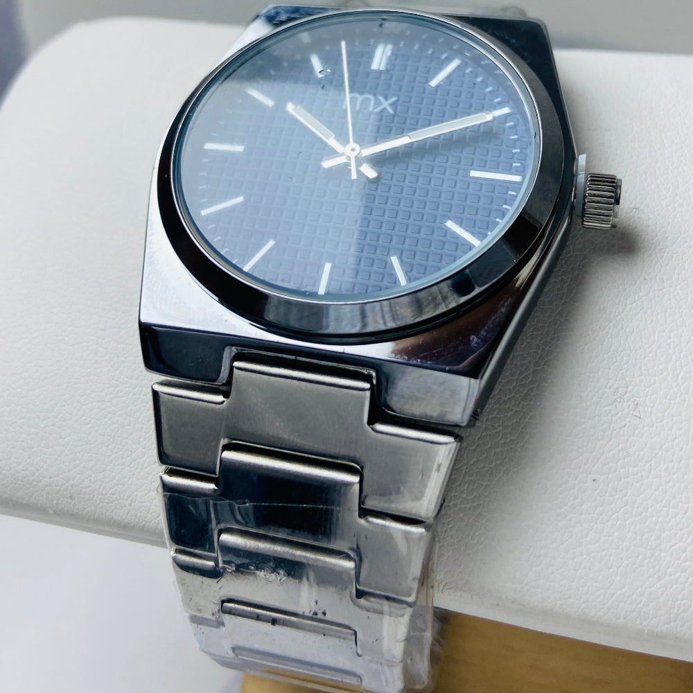 Silver watch with a blue face on a white surface Silver watch with a blue face on a white background silver watch with navy face on a white marble surface silver MX mens watch stainless steel watches timepiece timeless luxury best seller trending Deep Shine Jewellers DSJ Your Time To Shine quartz movement black dial silver stick markers 36mm silver bezel christmas presents gifts holiday season festive season xmas christmas sale Cape town south africa 