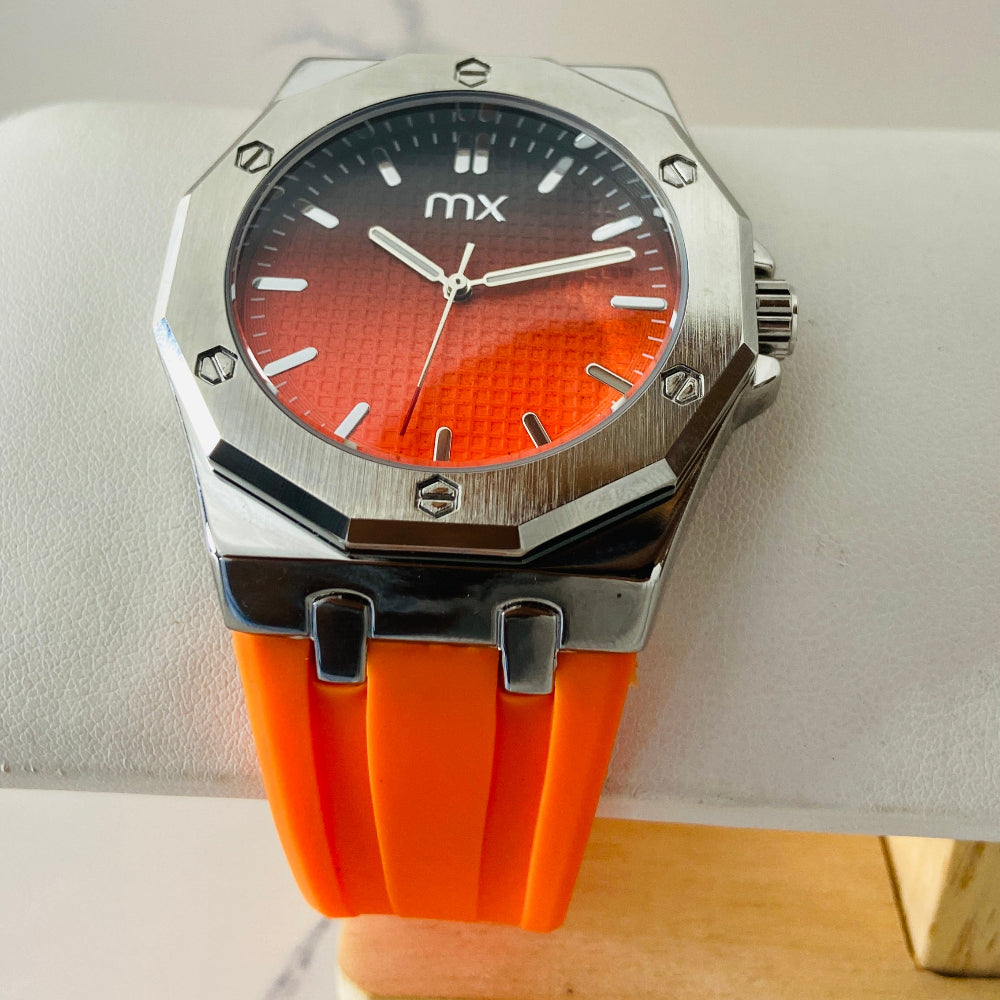 Wristwatch with orange strap and red face on a white background silver watch with black and orange face on a white marble surface MX mens watch stainless steel watches timepiece timeless luxury best seller trending Deep Shine Jewellers DSJ Your Time To Shine quartz movement black dial gold stick markers 36mm gold bezel rubber strap orange christmas sale xmas present holiday season festive season 