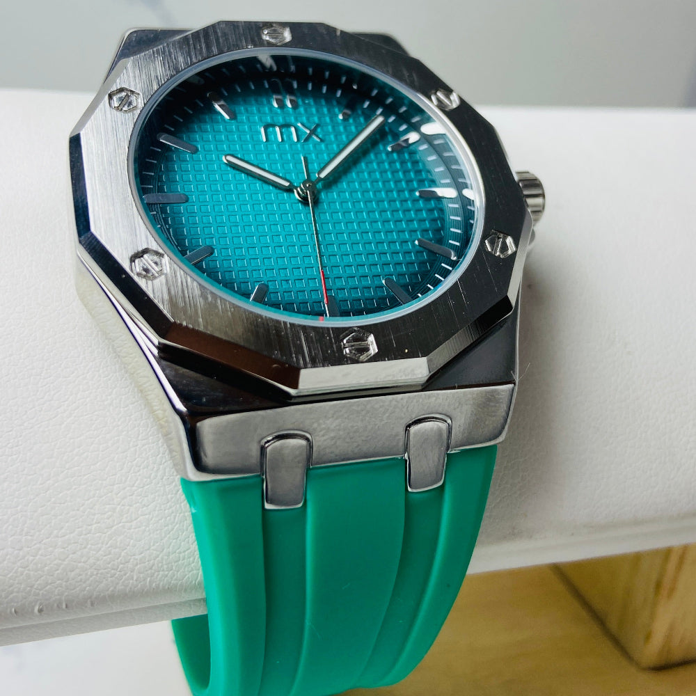 Turquoise watch with a silver case on a white background Wristwatch with orange strap and red face on a white background silver watch with black and orange face on a white marble surface MX mens watch stainless steel watches timepiece timeless luxury best seller trending Deep Shine Jewellers DSJ Your Time To Shine quartz movement black dial gold stick markers 36mm gold bezel rubber strap orange christmas sale xmas present holiday season festive season 