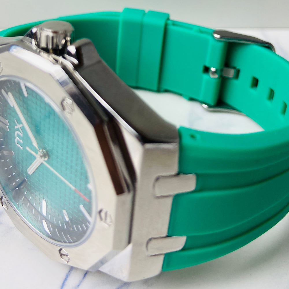 Teal watch with a silver case on a marble surface Wristwatch with orange strap and red face on a white background silver watch with black and orange face on a white marble surface MX mens watch stainless steel watches timepiece timeless luxury best seller trending Deep Shine Jewellers DSJ Your Time To Shine quartz movement black dial gold stick markers 36mm gold bezel rubber strap orange christmas sale xmas present holiday season festive season 