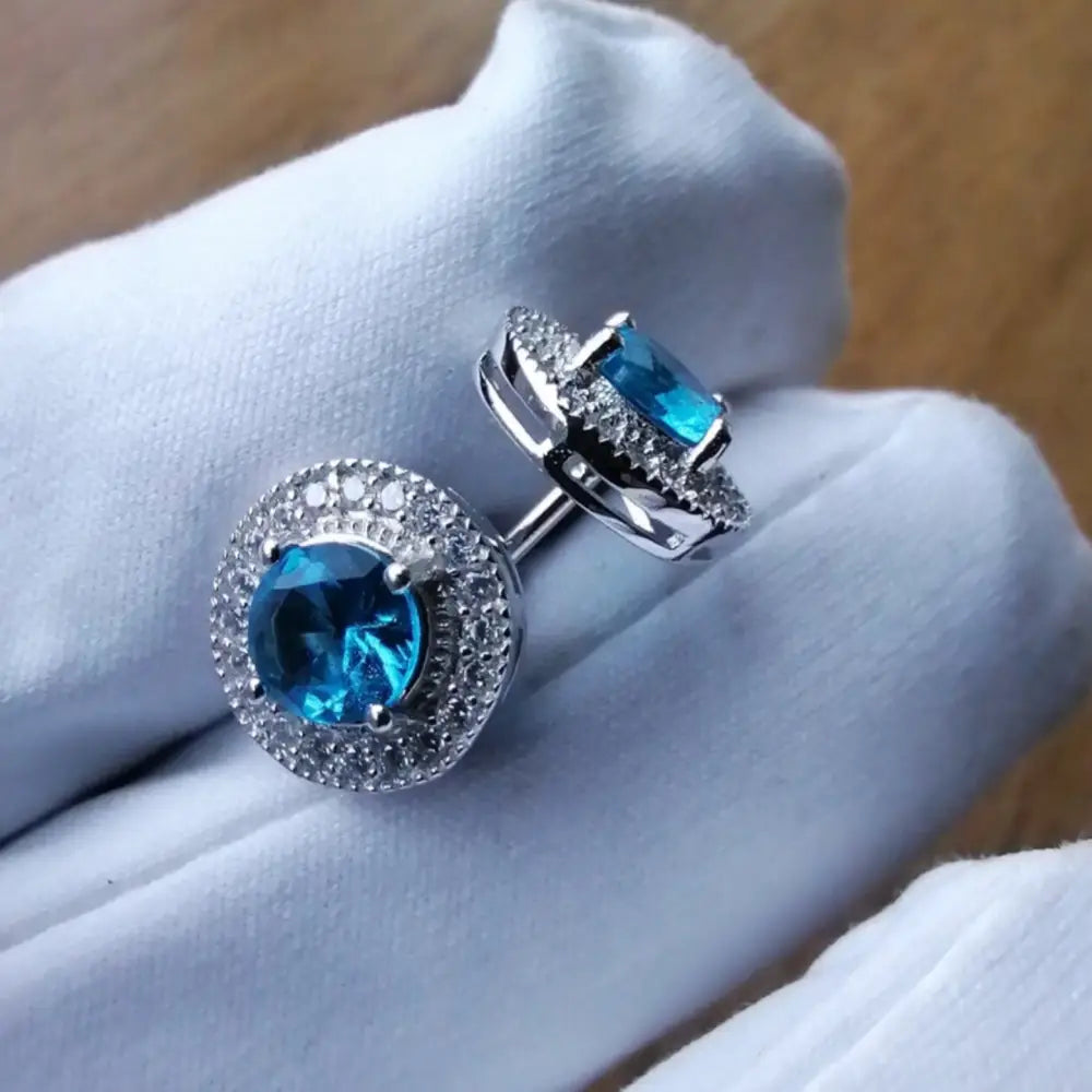 Silver cufflinks with blue gemstones and clear stones in white gold silver finish