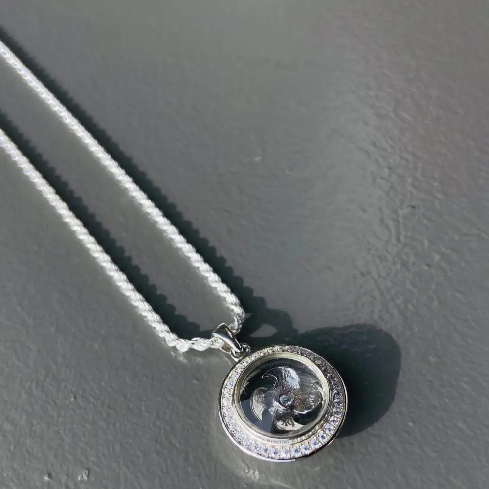 Silver flooded spinning Clover Necklace with clear pendant and glittering stones