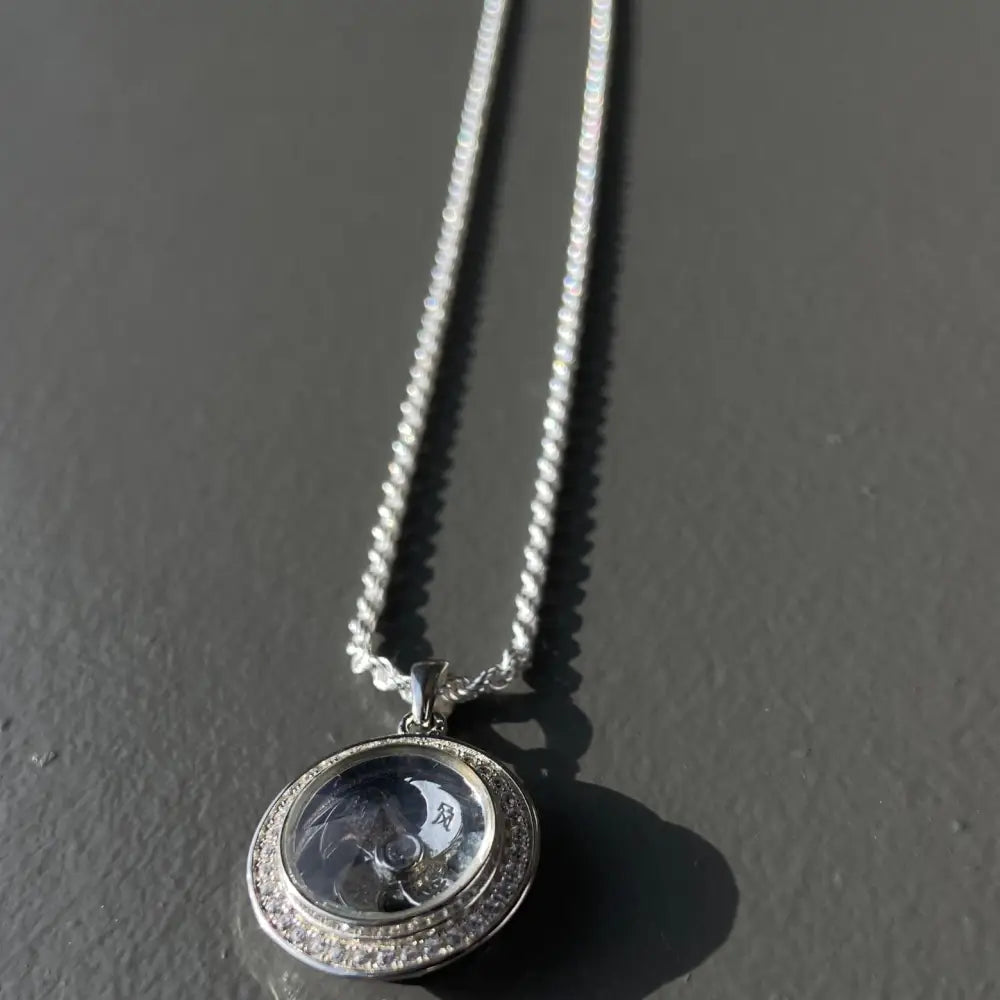 Silver flooded spinning Clover Necklace with clear pendant and glittering stones