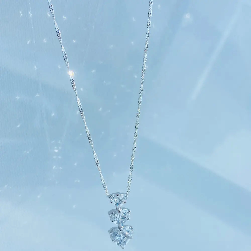 Silver three tier necklace with sparkling diamond heart pendants in white gold shine. Jewellery silver jewellery Deep Shine Jewellers