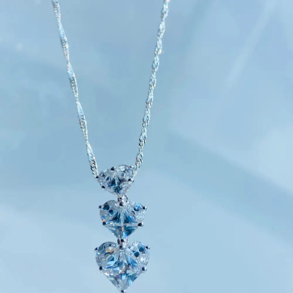 Silver three tier necklace with three heart-shaped cubic zirconia pendants in white gold shine. Jewellery silver jewellery Deep Shine Jewellers